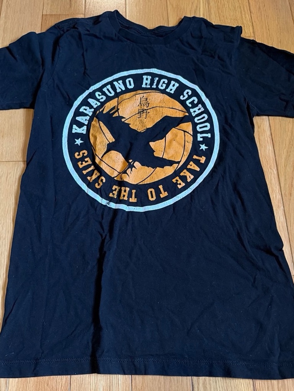 Kids Black Graphic Tee with Orange & Light Blue Emblem